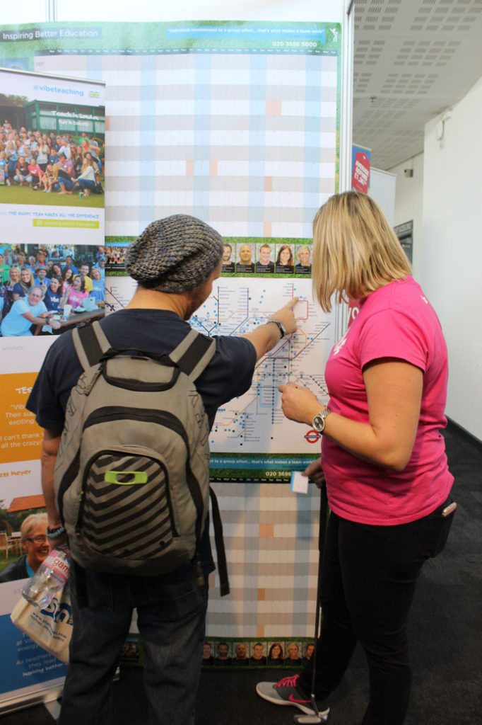 Vibe Teachers examining London underground map of school network at the TNT Travel Show