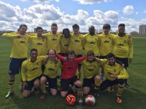 Vibe Teacher Ian with his football team on the pitch in London