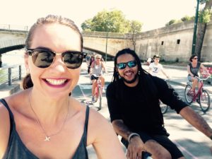 Vibe Early Years Teacher Ashleigh cycling along the Thames in London UK