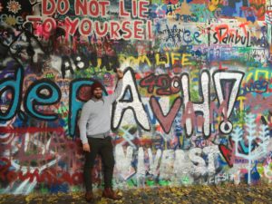Vibe Teaching Consultant Cameron In Front of Graffiti
